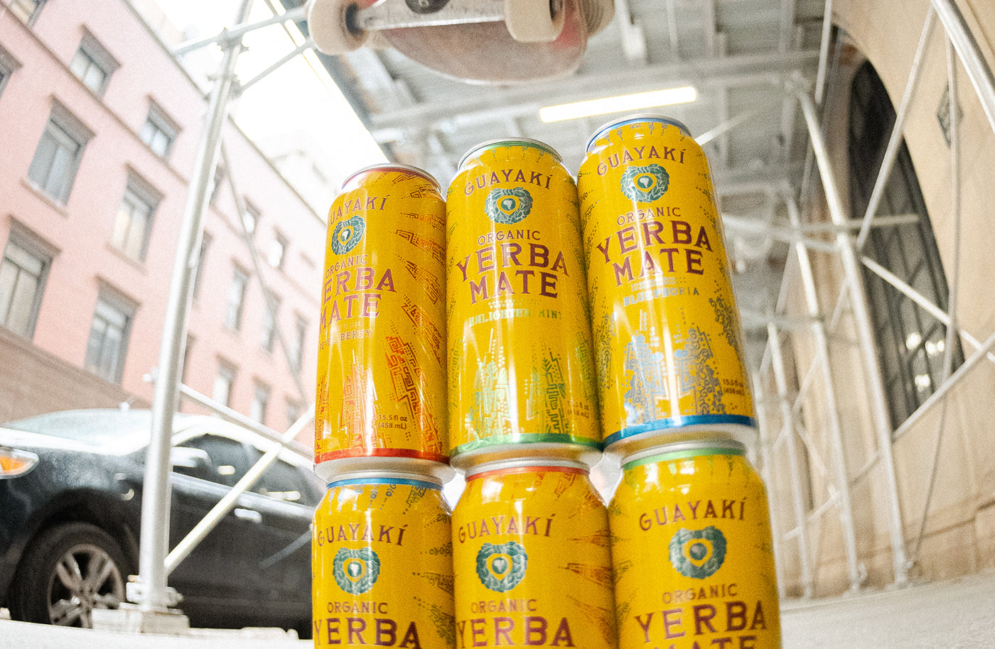 Stack of cans of Yerba Madre on the sidewalk